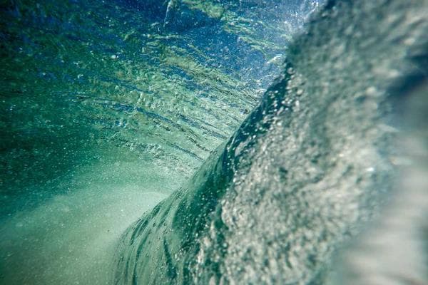 Person smiling at a laptop